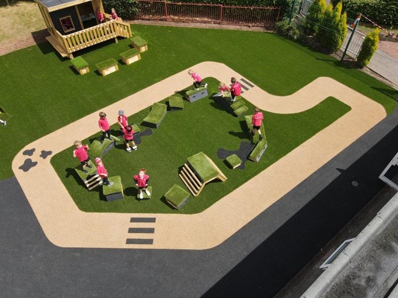 articifial grass playground with Pentagon Play's Get Set, Go! Blocks