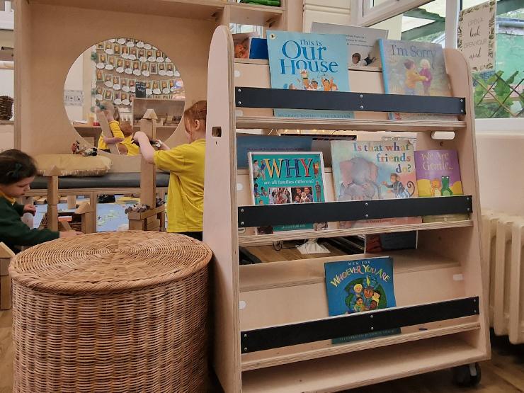 A book storage unit on wheels in a primary school classroom