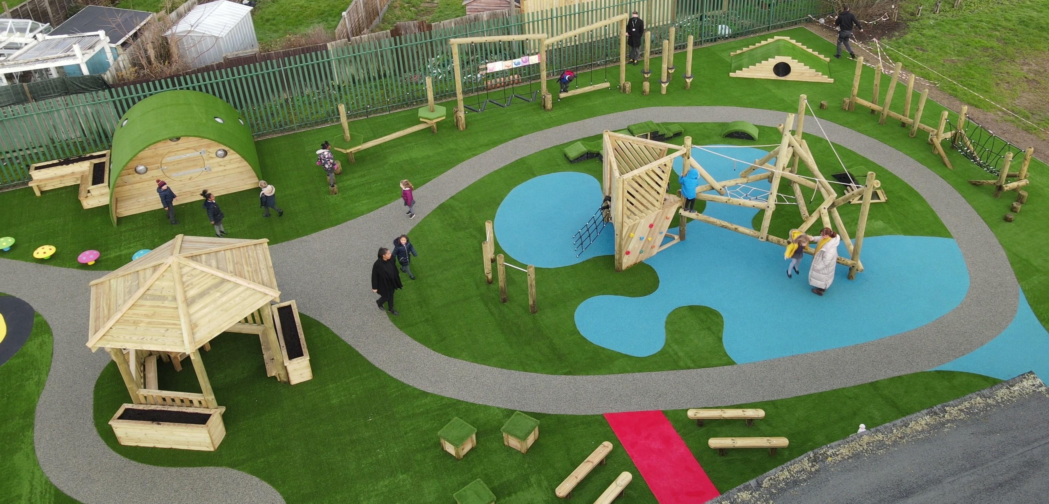 large playground scheme for primary school with climbing frame, artificial grass, outdoor classroom and trim trails