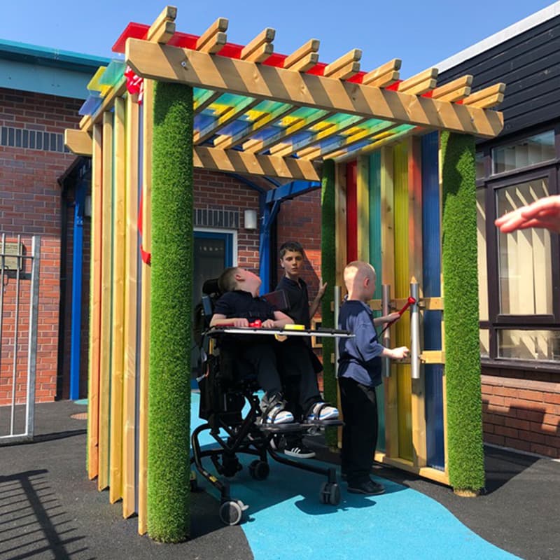 SEN children enjoying play time in the Pentagon Play Sensory Arbour outside in the playground