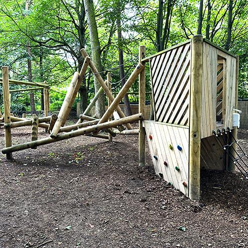 wooden trim trail climbing frame in forest setting